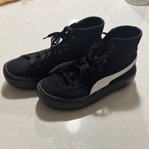 High top platform Puma Sneakers. Minimal staining on left outside shoe.